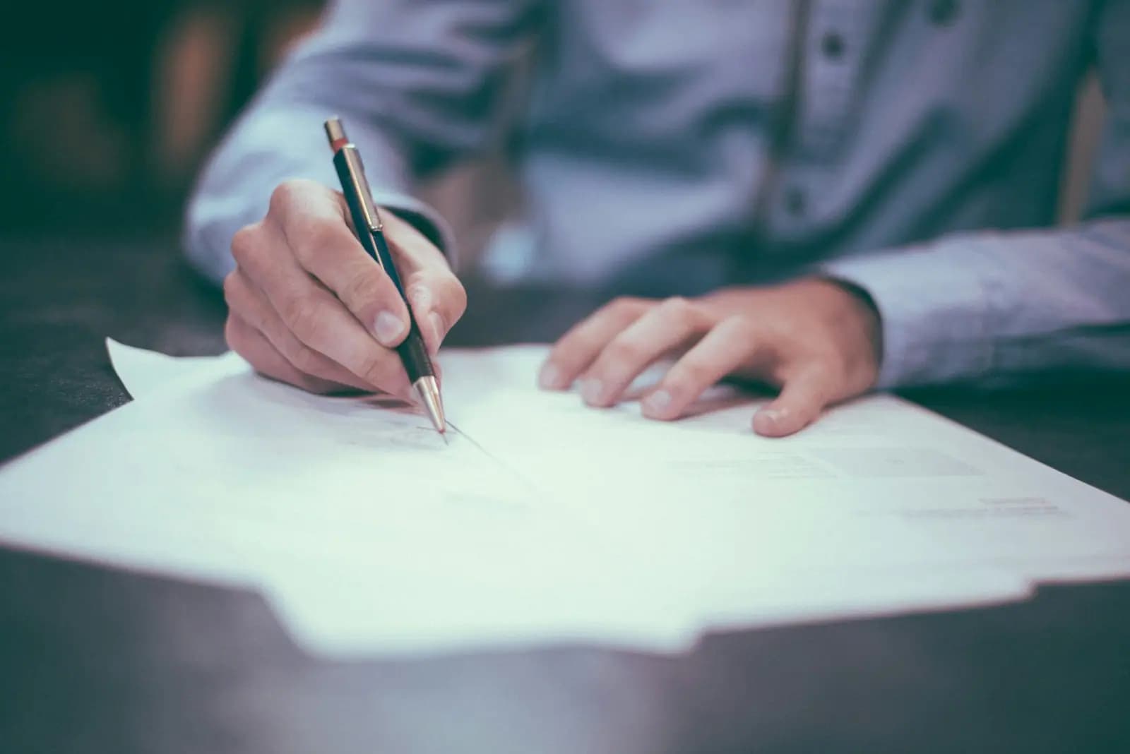 Lawyer-client handshake symbolizing trust at Suwanvara Law Firm